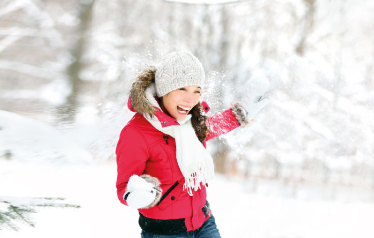 Woman with red coat in snow