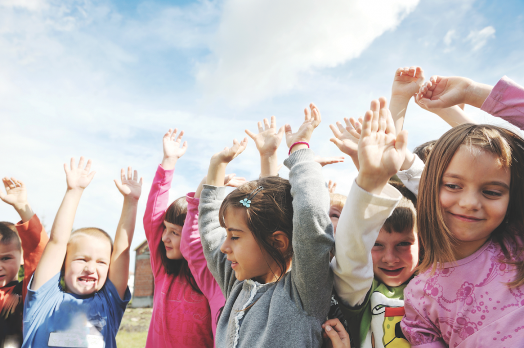 Kids raising hands