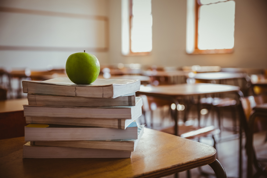 School Books on Desk Apple