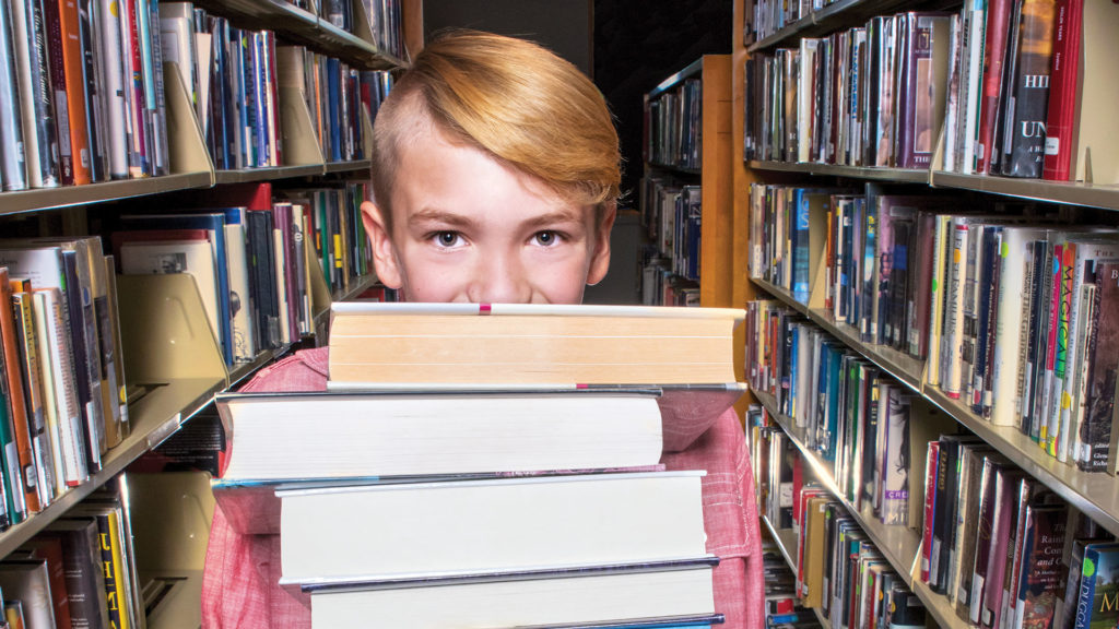 Boy holding books