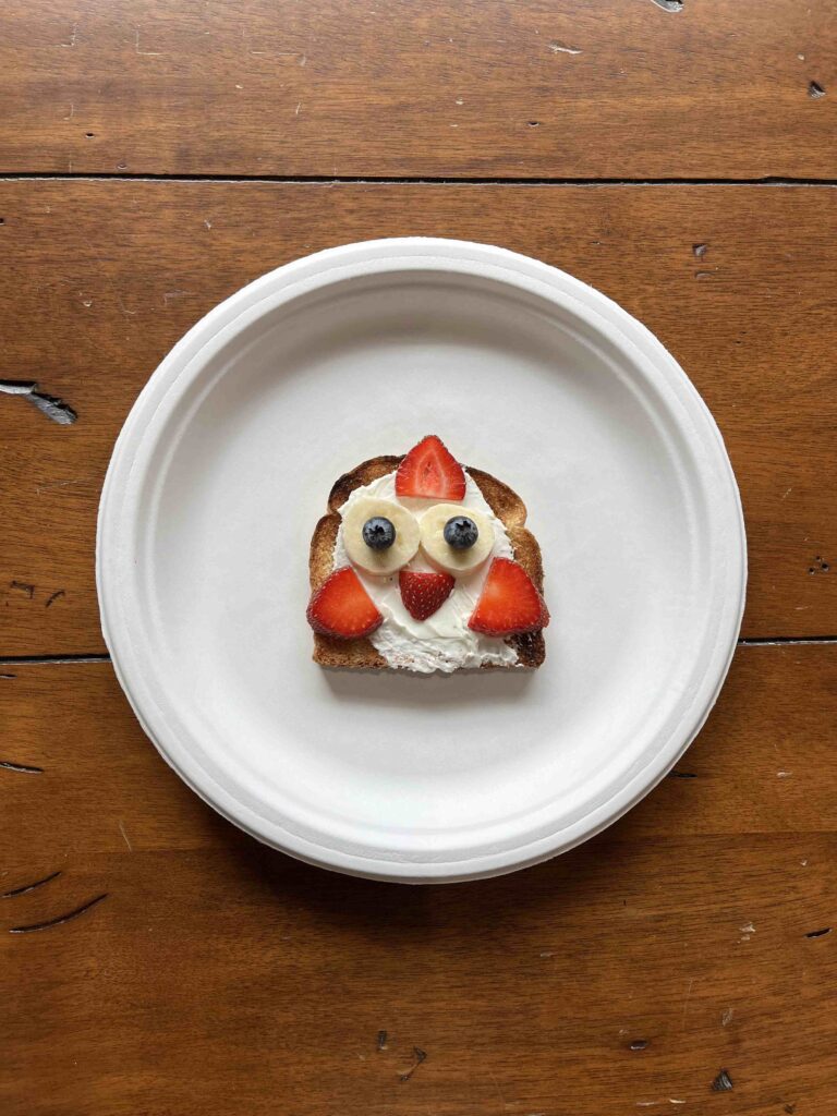 Owl toast made with cream cheese, bananas, strawberries and blue berries